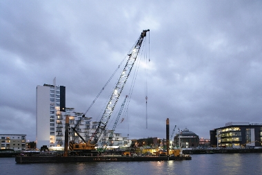 Clyde Arc crane on barge and lit at dusk